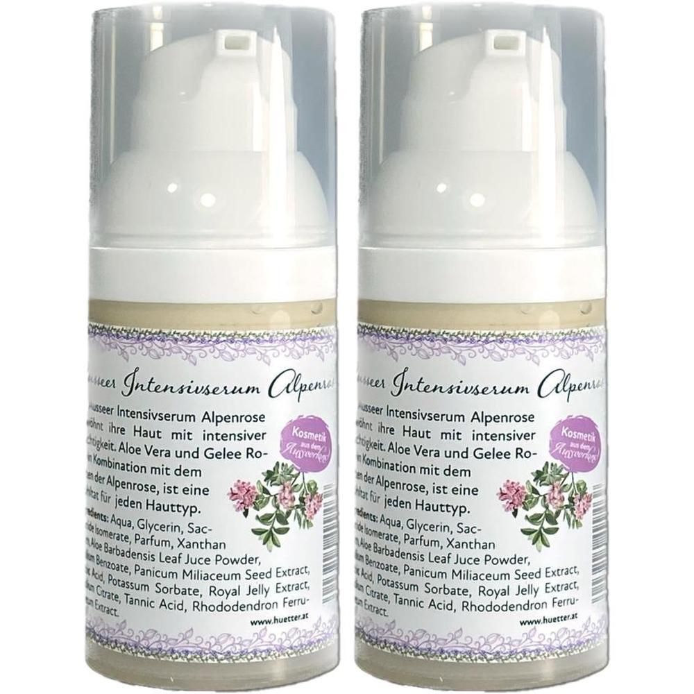 Zwei weiße Spenderflaschen mit Aufschrift "Intensivserum Alpenrose". Etikett mit floralem Design und Produktinformationen.