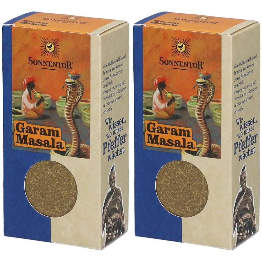 Zwei rechteckige Kartons. Aufdruck: SonnentoR Garam Masala. Abbildung: Kobra, Mann, Töpfe. Sichtfenster mit Inhalt.
