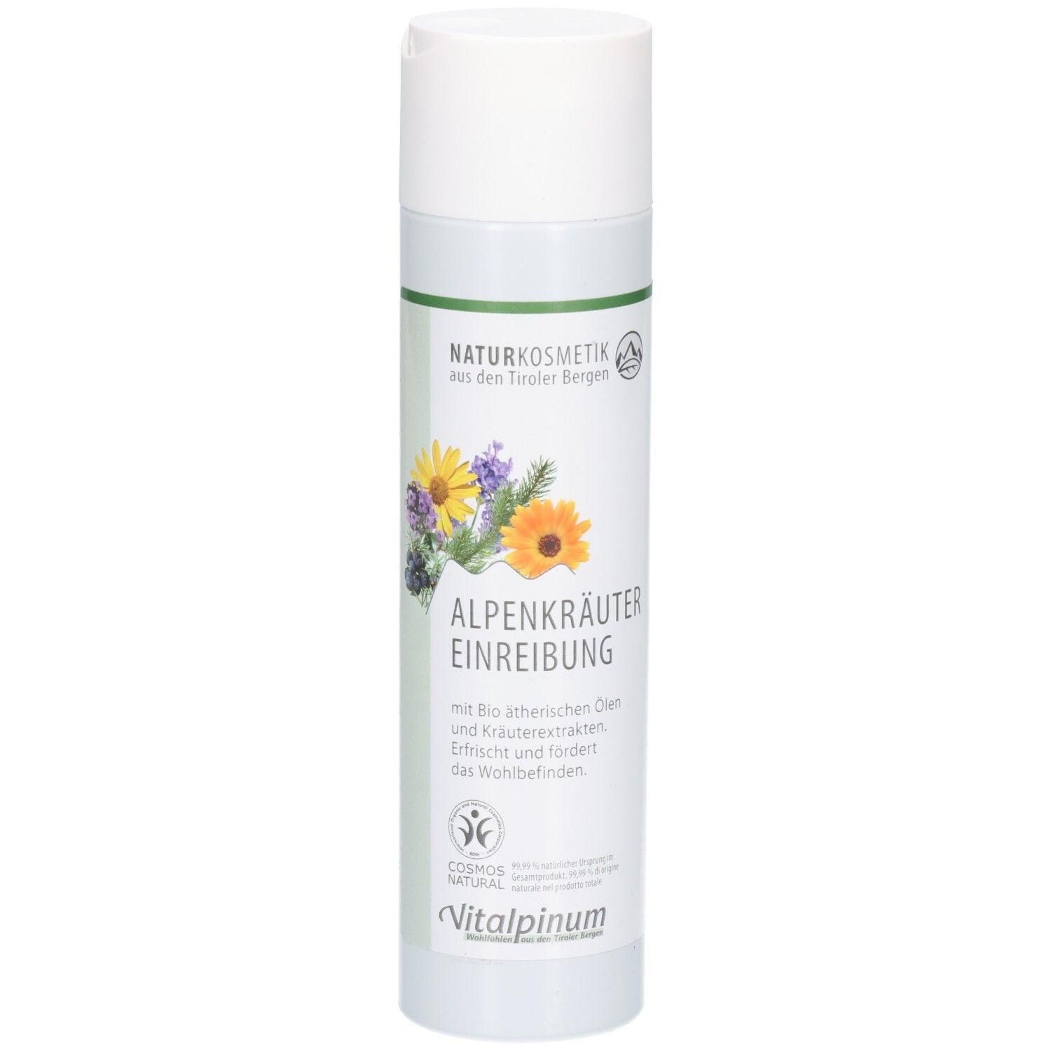 Weiße Flasche mit grünem Streifen und Blumenmotiv. Text: NATURKOSMETIK, ALPENKRÄUTER EINREIBUNG, Vitalpinum.