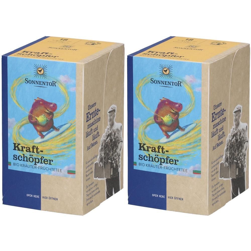Zwei Kartons mit blau-brauner Verpackung. Aufdruck: Sonnentor, Kraftschöpfer Tee, Illustration eines Schweins auf Surfbrett.