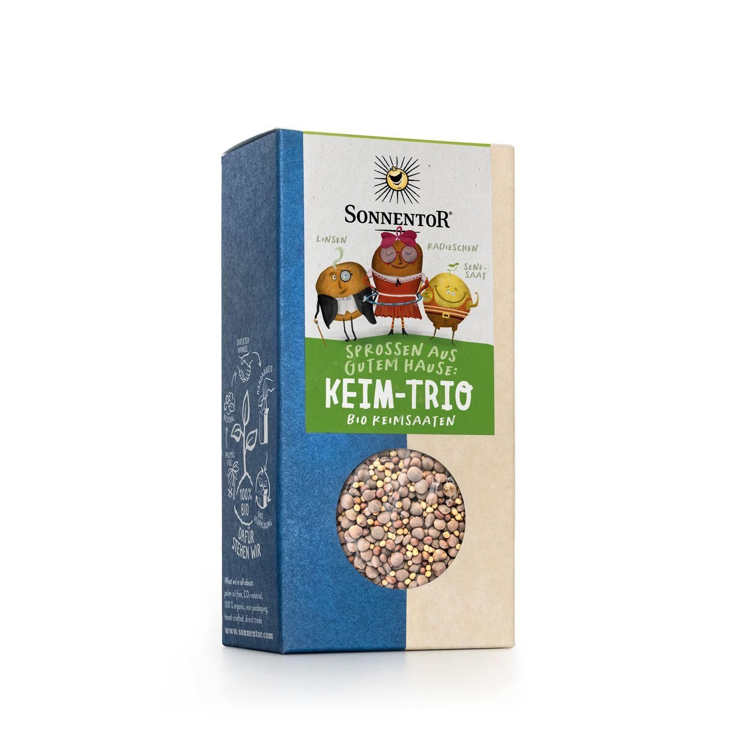 Kartonverpackung mit Sichtfenster. Aufschrift: SonnentoR, Keim-Trio, Bio-Feinsaat. Illustrationen von Figuren. Sichtbares Saatgut im Fenster.