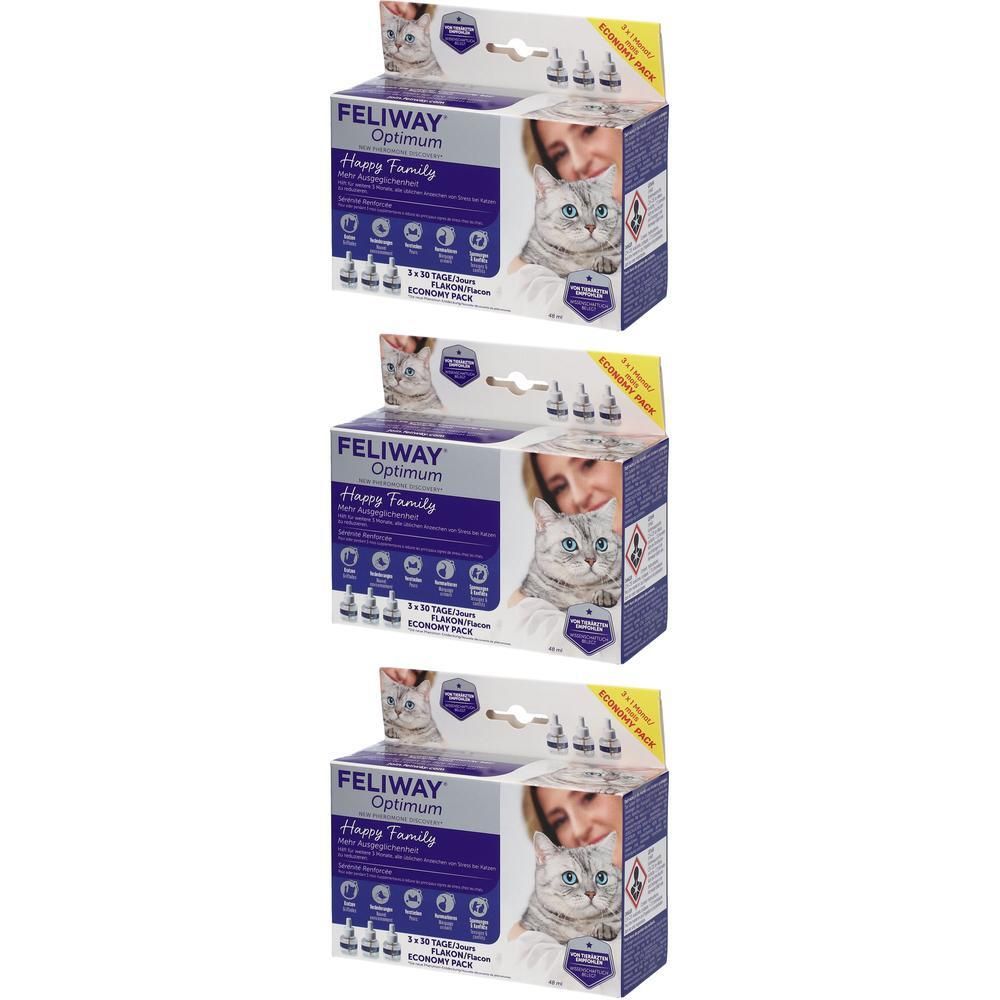 Drei Kartons FELIWAY Optimum Happy Family. Auf jedem Karton ist ein Foto einer Frau mit Katze abgebildet. Die Verpackung enthält Flakons.