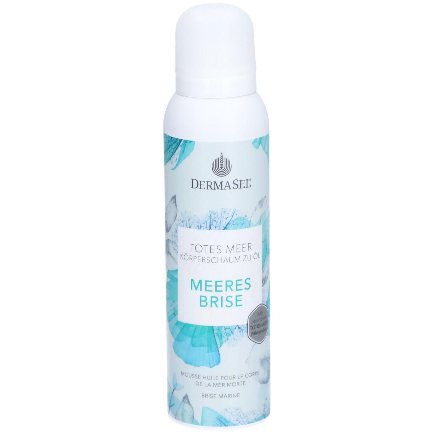 Weiße Sprühflasche mit blau-türkisem floralem Muster. Beschriftung: DERMASEL, TOTES MEER, MEERES BRISE. Produktname und Marke sichtbar.