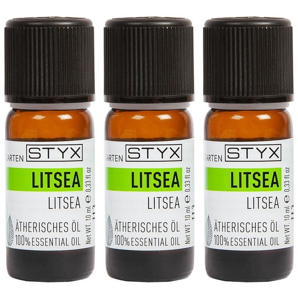 Drei braune Glasflaschen mit schwarzen Deckeln. Auf den Etiketten steht "STYX LITSEA Ätherisches Öl".