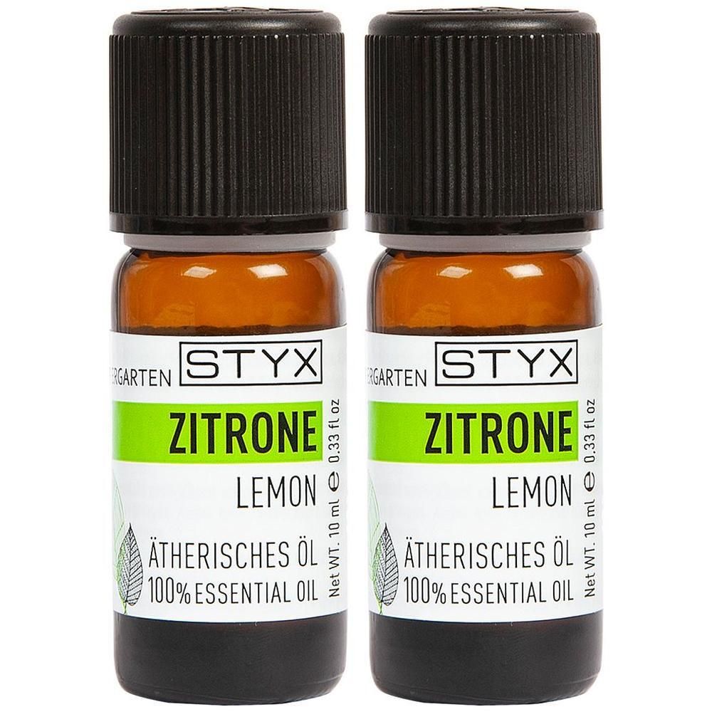 Zwei braune Glasflaschen mit schwarzem Deckel. Auf den Etiketten steht "Zitrone", "Lemon" und "Ätherisches Öl".