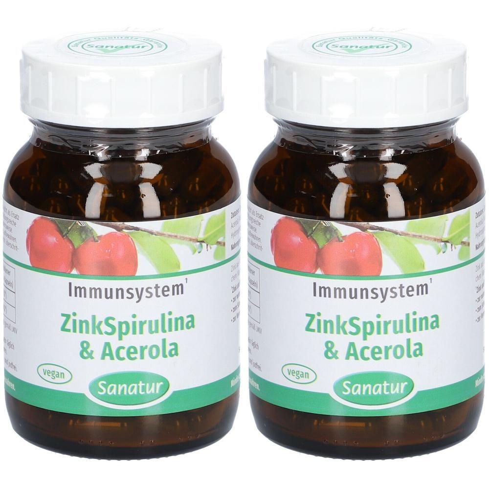Zwei Braunglasflaschen mit weißen Schraubverschlüssen, gefüllt mit Zink, Spirulina und Acerola Kapseln. Etikett mit Acerola-Früchten und 'Immunsystem' Aufschrift.