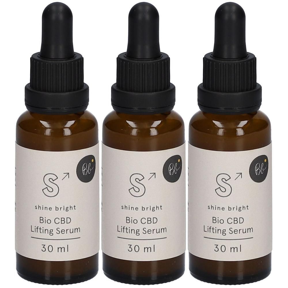Drei braune Glasflaschen mit schwarzen Pipetten. Auf den Etiketten steht "shine bright Bio CBD Lifting Serum 30 ml".