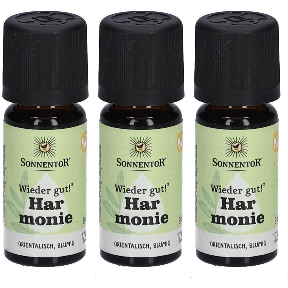 Drei kleine braune Glasflaschen mit schwarzen Deckeln. Auf den Etiketten steht "Sonnentor", "Wieder gut! Harmonie".