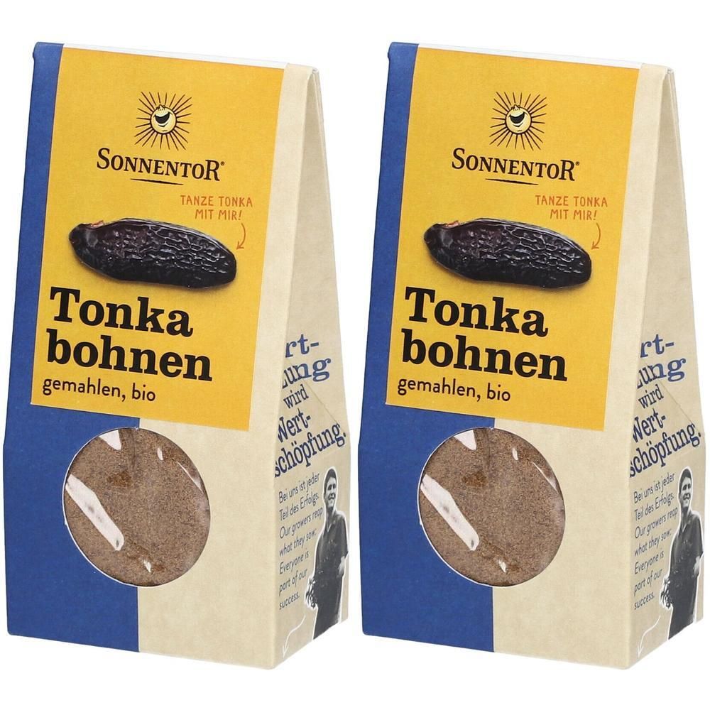 Zwei Beutel SonnentoR Tonkabohnen gemahlen. Gelber Aufdruck mit Produktname und Logo. Sichtfenster zeigt Inhalt.