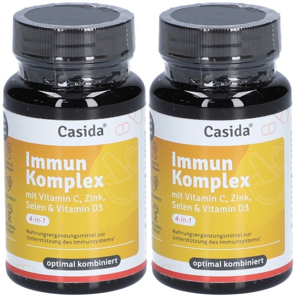 Zwei Flaschen Casida Immun Komplex. Schwarze Flaschen mit gelben Etiketten. Aufschrift: Immun Komplex, mit Vitamin C, Zink, Selen & Vitamin D3.