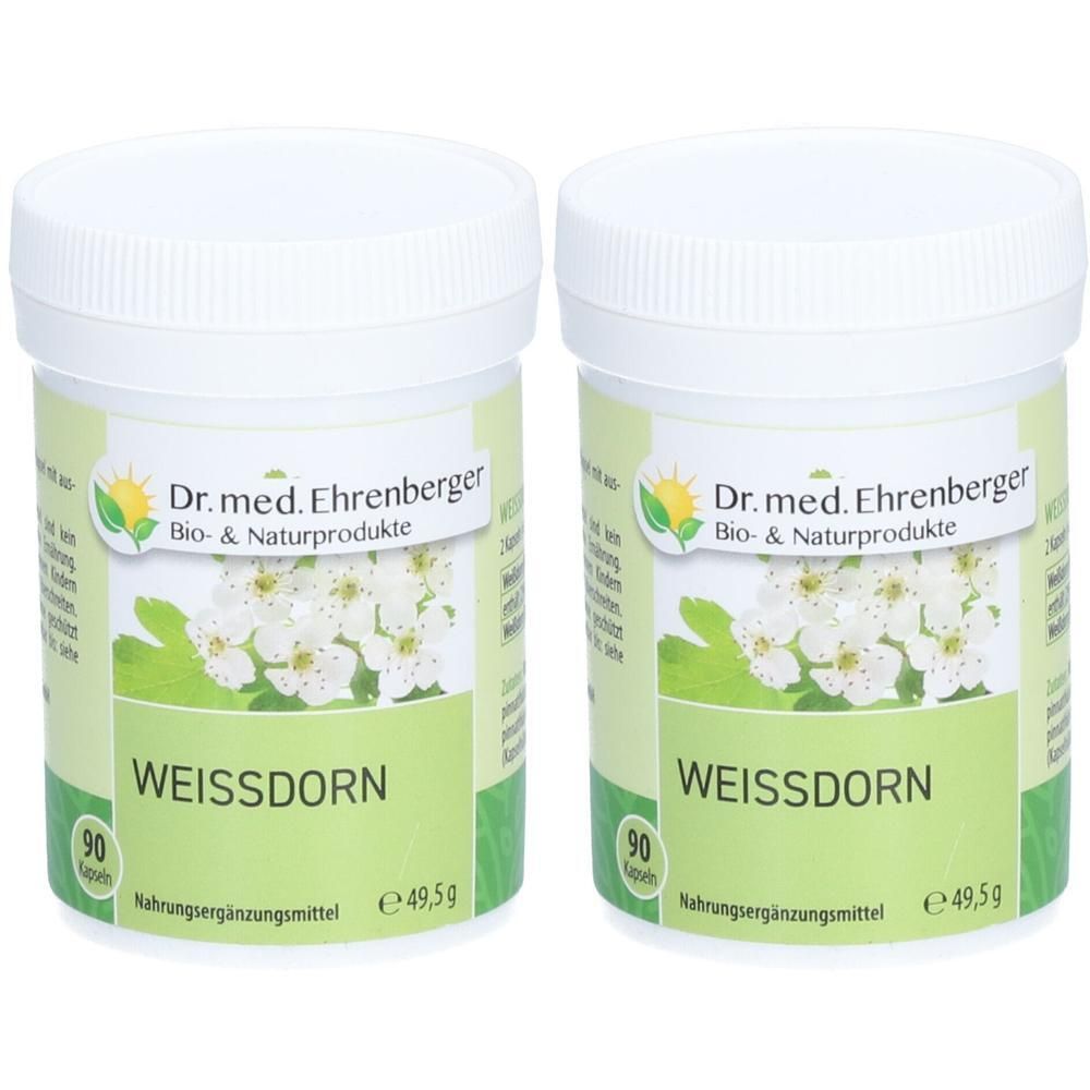 Zwei weiße Dosen mit Deckel. Aufschrift: Dr. med. Ehrenberger WEISSDORN. Grün-weiße Etiketten mit Blüten. 90 Kapseln. Nahrungsergänzungsmittel.