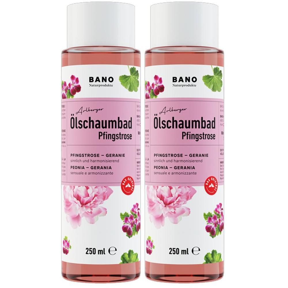 Zwei Flaschen Arlberger Ölschaumbad Pfingstrose. Rosa Flüssigkeit in transparenten Flaschen mit weißem Deckel. Etikett mit Produktnamen und floralen Illustrationen.