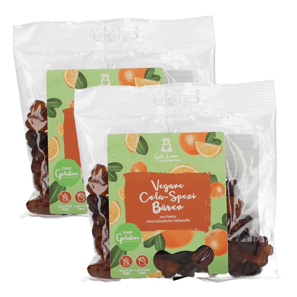 Zwei Beutel veganer Cola-Spezi Bären mit Orangenmotiv. Ohne Gelatine, Gluten und Laktose.