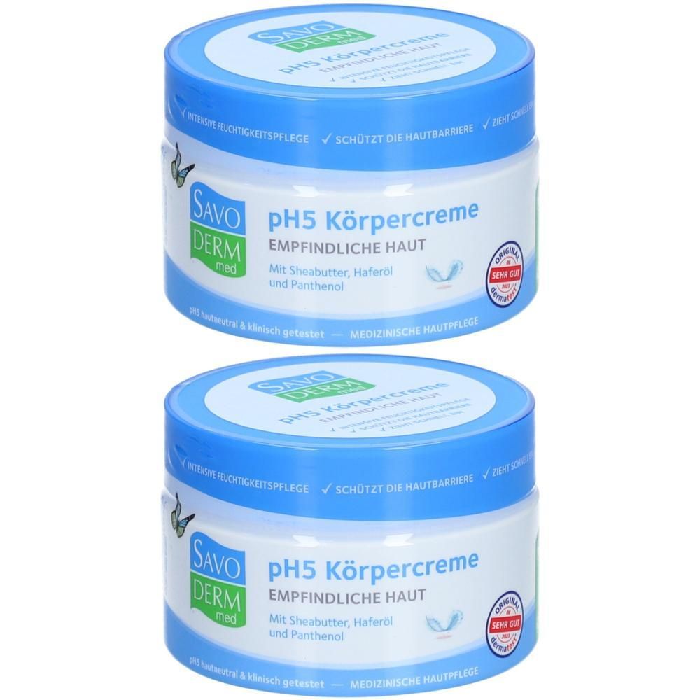 Zwei Tiegel SAVODERM pH5 Körpercreme. Blaue Deckel, weiße Behälter. Aufschrift: EMPFINDLICHE HAUT. Mit Sheabutter, Haferöl und Panthenol. Medizinisches Hautpflegeprodukt.