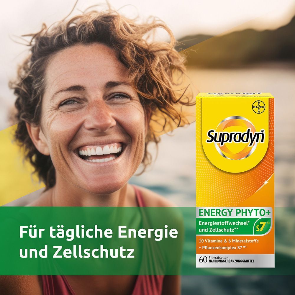 Frau lächelt. Neben ihr eine gelbe Schachtel "Supradyn Energy Phyto+". Text: Für tägliche Energie und Zellschutz.