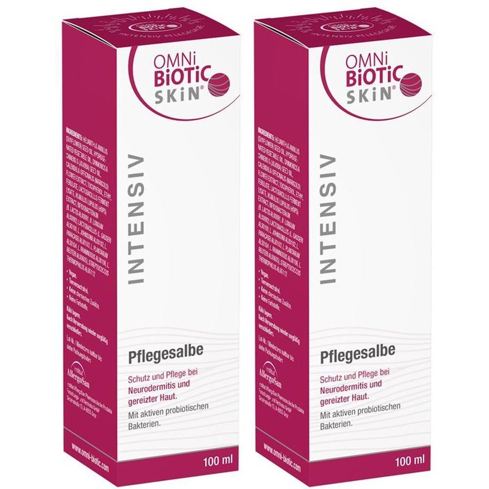 Zwei Packungen OMNi-BiOTiC SKiN Intensiv-Pflegesalbe. Rechteckige, rosa-weiße Kartons mit Produktnamen und Text.