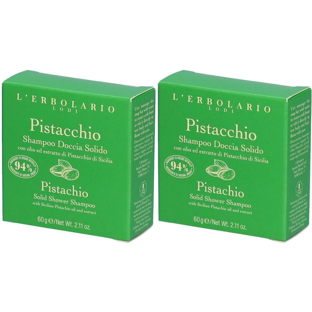 Zwei grüne Kartons mit "L'Erbolario Pistacchio" Shampoo. Aufschrift: "Shampoo Doccia Solido". 94% natürliche Inhaltsstoffe.