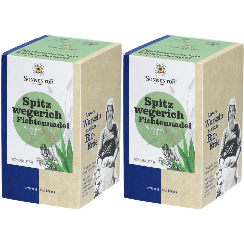 Zwei rechteckige Kartons. Aufdruck: SonnentoR, Spitzwegerich Fichtennadel, Bio Kräuter. Grün-beige Verpackung mit Illustration.