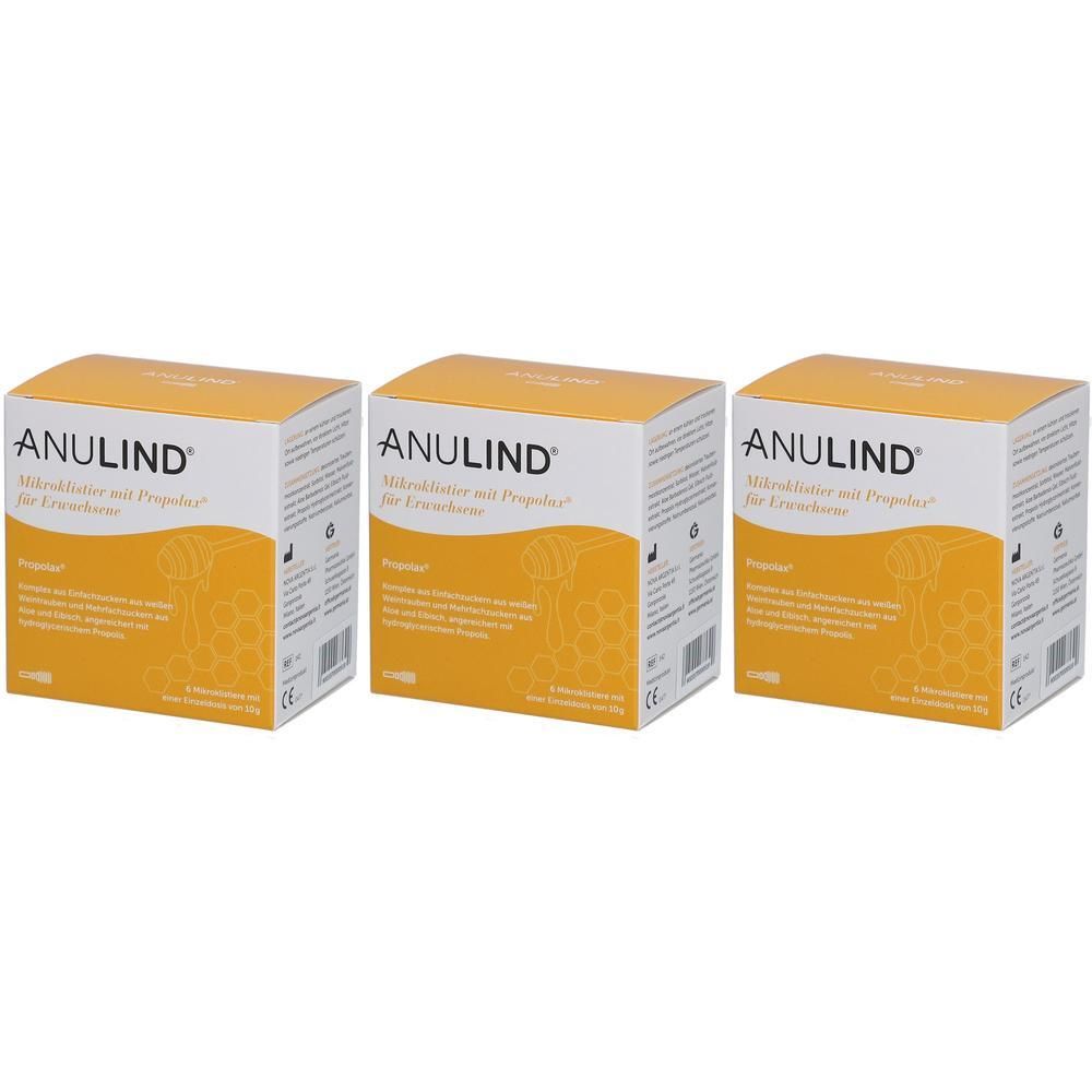 Drei Kartons ANULIND. Weiße Schachteln mit gelben Akzenten und Produktinformationen. Aufschrift ANULIND Mikroklistier für Erwachsene.