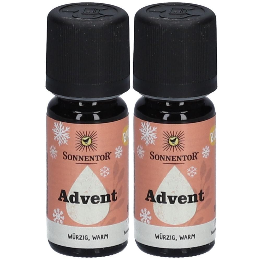 Zwei kleine Glasflaschen mit schwarzem Deckel. Auf dem Etikett steht "Advent" und "SONNENTOR". Mit Schneeflocken-Design.