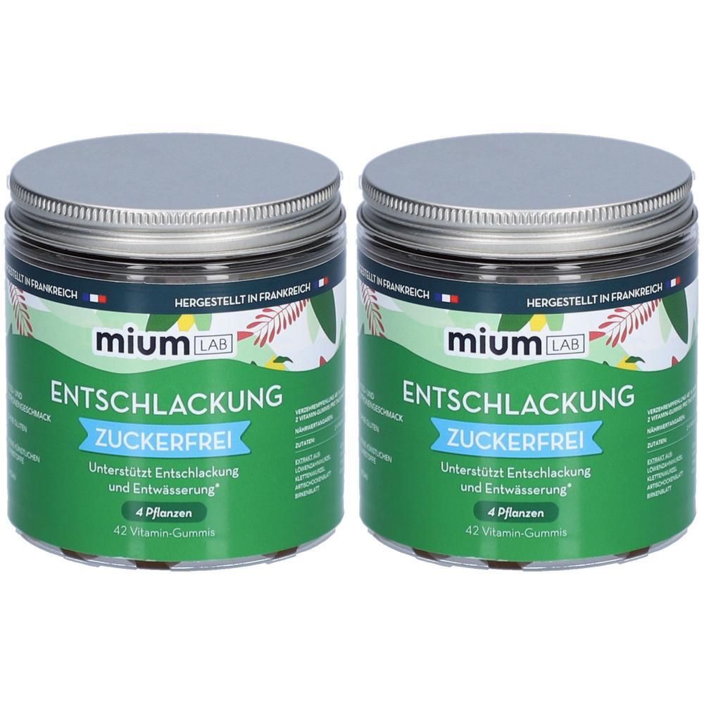 Zwei Dosen mit silbernen Deckeln. Aufschrift: mium LAB, Entschlackung Zuckerfrei. 42 Vitamin-Gummis. Hergestellt in Frankreich.