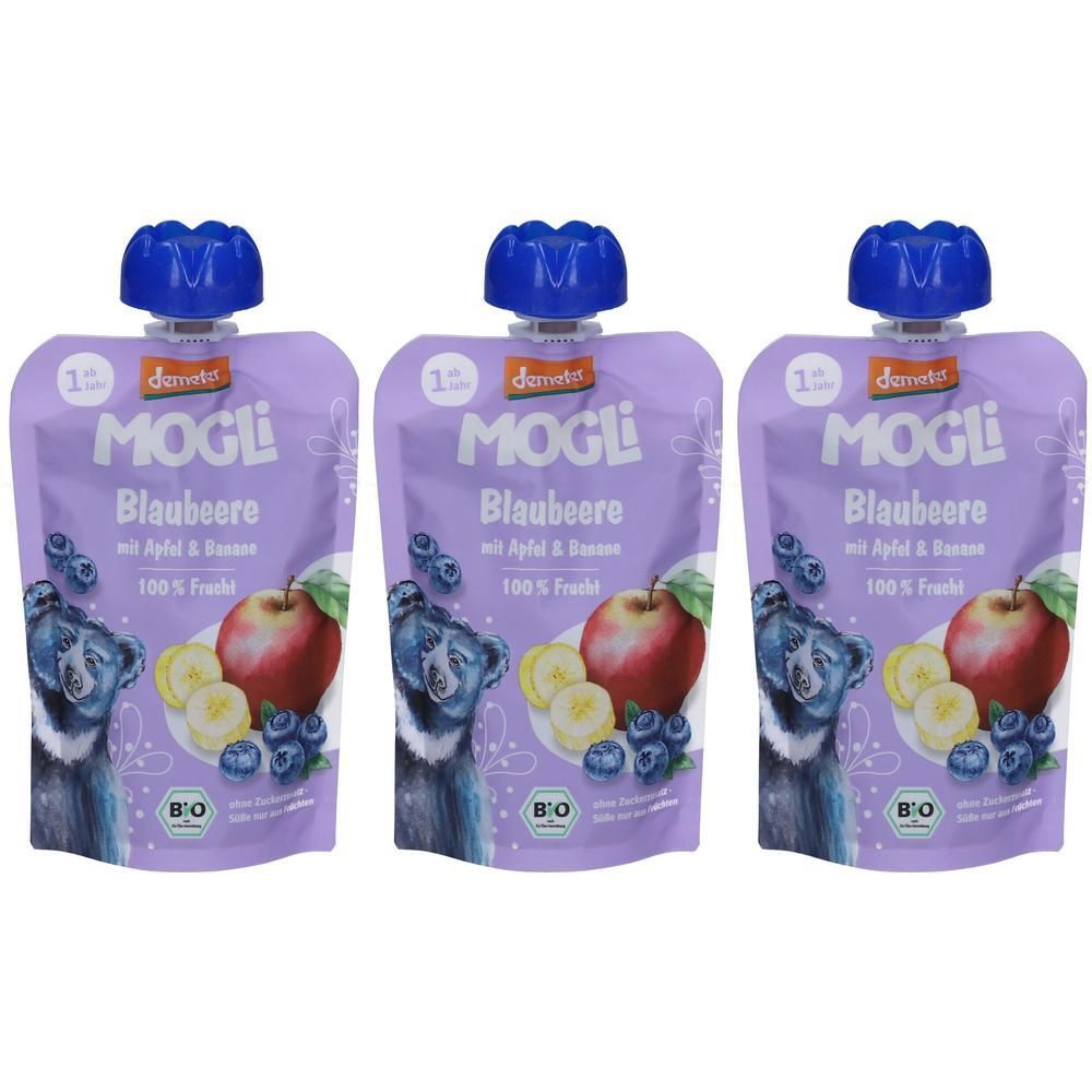 Drei Quetschbeutel MOGLI BIO Blaubeere. Lila Verpackung mit Abbildung von Früchten und einem Bären. Blaue Verschlusskappe.