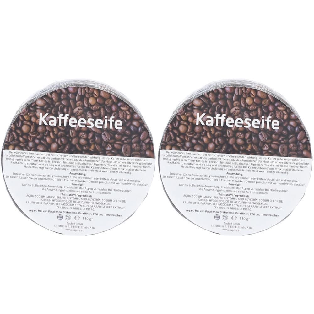 Zwei runde Seifenstücke mit Kaffeebohnen-Muster und "Kaffeesseife" Aufschrift.