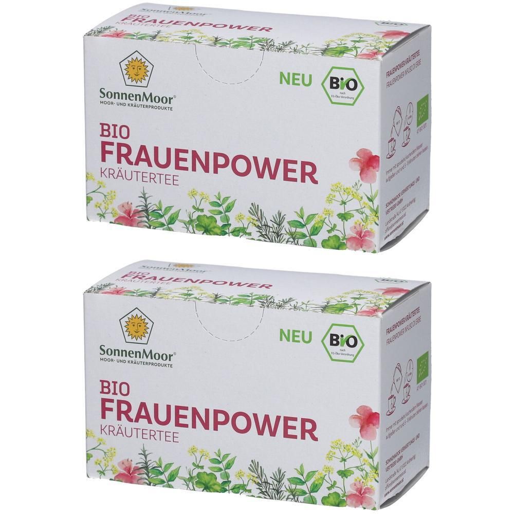 Zwei Kartons Kräutertee. Aufdruck: SonnenMoor, BIO Frauenpower, Kräutertee. Mit Bio-Siegel und Aufschrift "NEU". Dekoration mit Pflanzen.