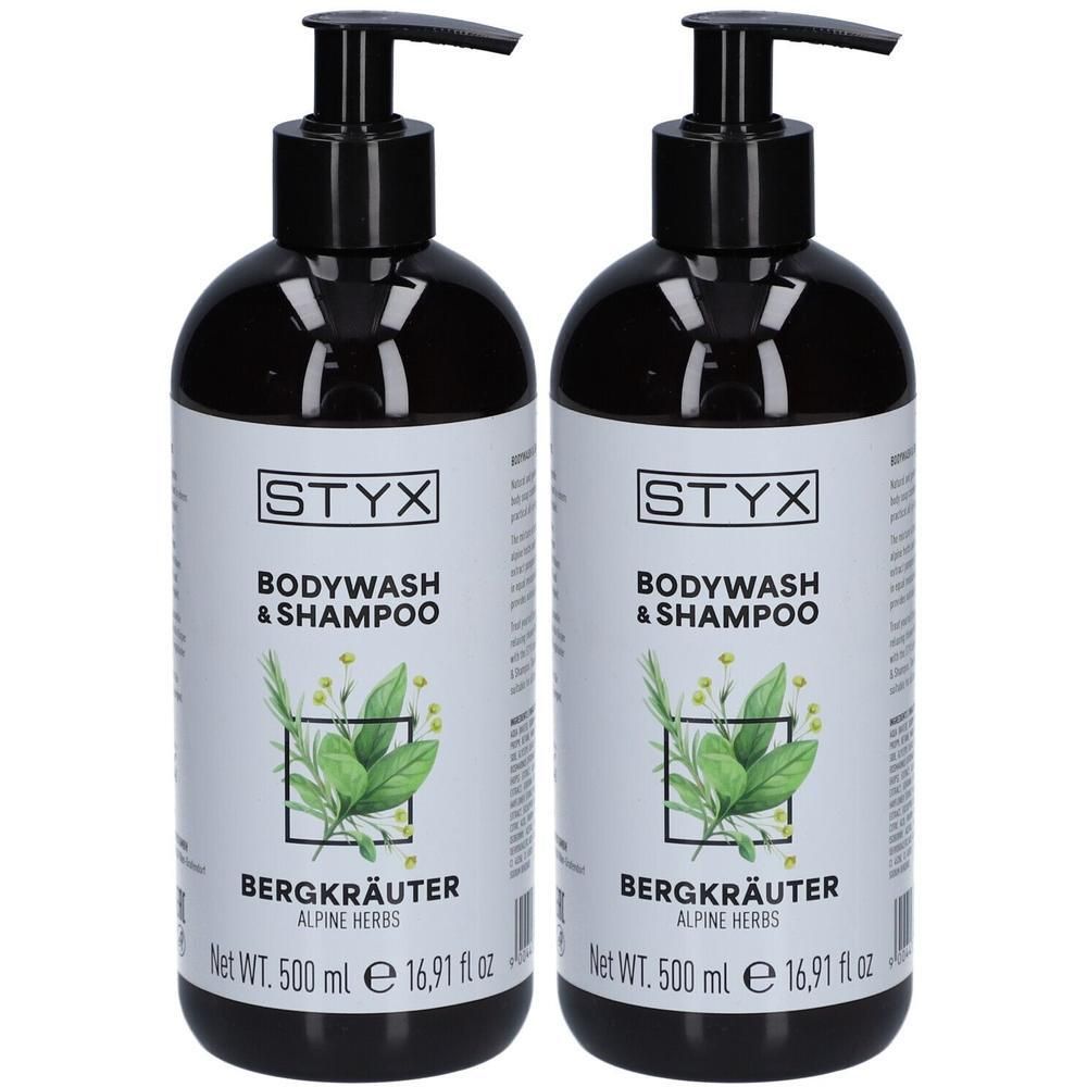Zwei schwarze Flaschen STYX Bodywash & Shampoo Bergkräuter. Jede Flasche hat einen schwarzen Pumpkopf und ein weißes Etikett mit Produktinformationen.