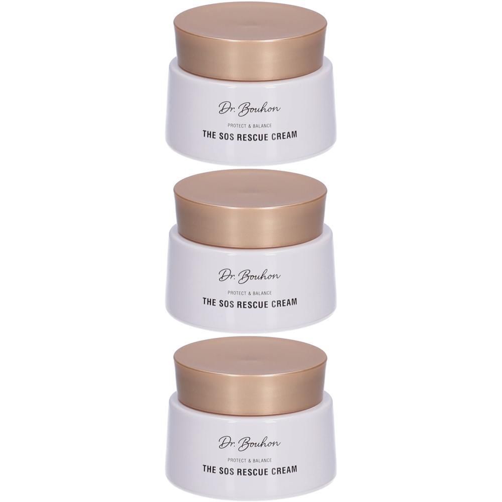 Drei weiße Cremetiegel mit goldenen Deckeln, beschriftet mit 'Dr. Bouhon THE SOS RESCUE CREAM'.
