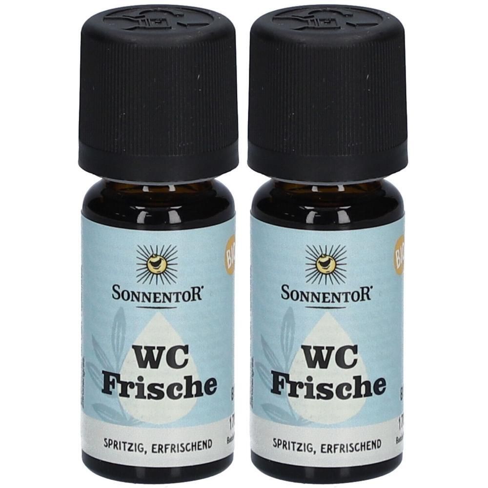 Zwei Flaschen SONNENTOR WC Frische ätherisches Öl bio. Braune Glasflaschen mit schwarzen Deckeln und Etiketten mit Produktnamen und Logo.