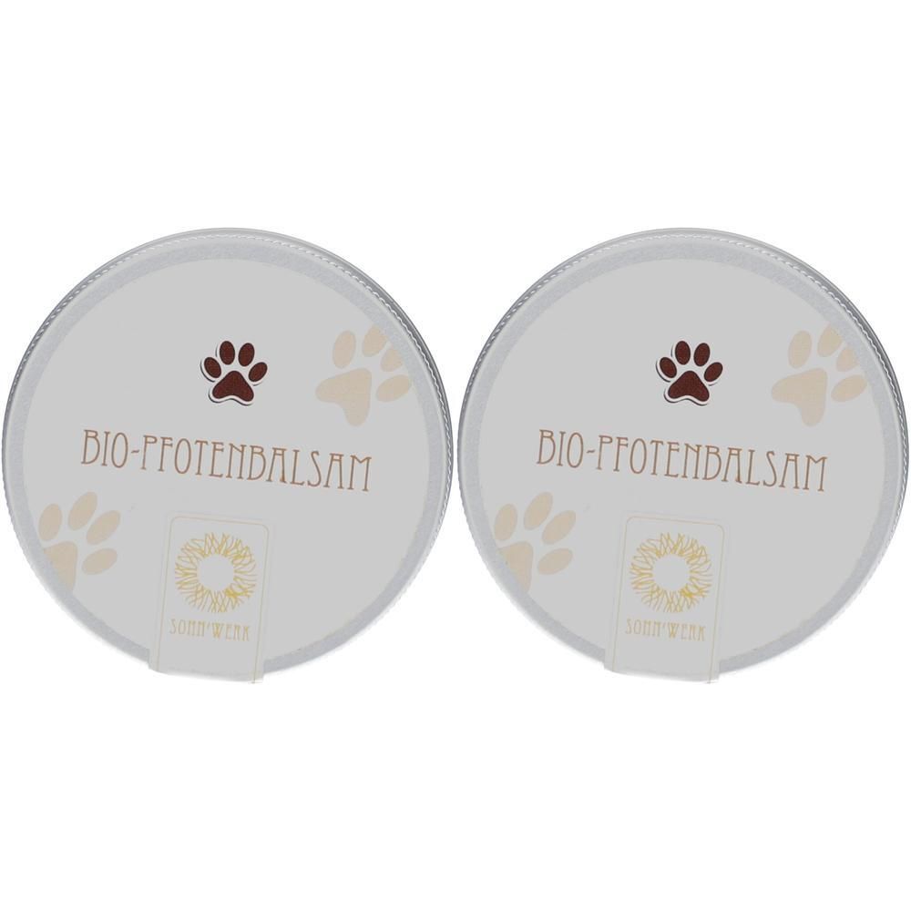 Zwei runde Dosen mit "BIO-PFOTENBALSAM" Aufschrift und Pfotenabdrücken.