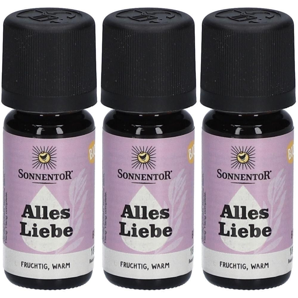 Drei Fläschchen Sonnentor Alles Liebe ätherisches Öl bio. Schwarze Schraubverschlüsse, lila Etiketten mit Sonne und Tropfen.