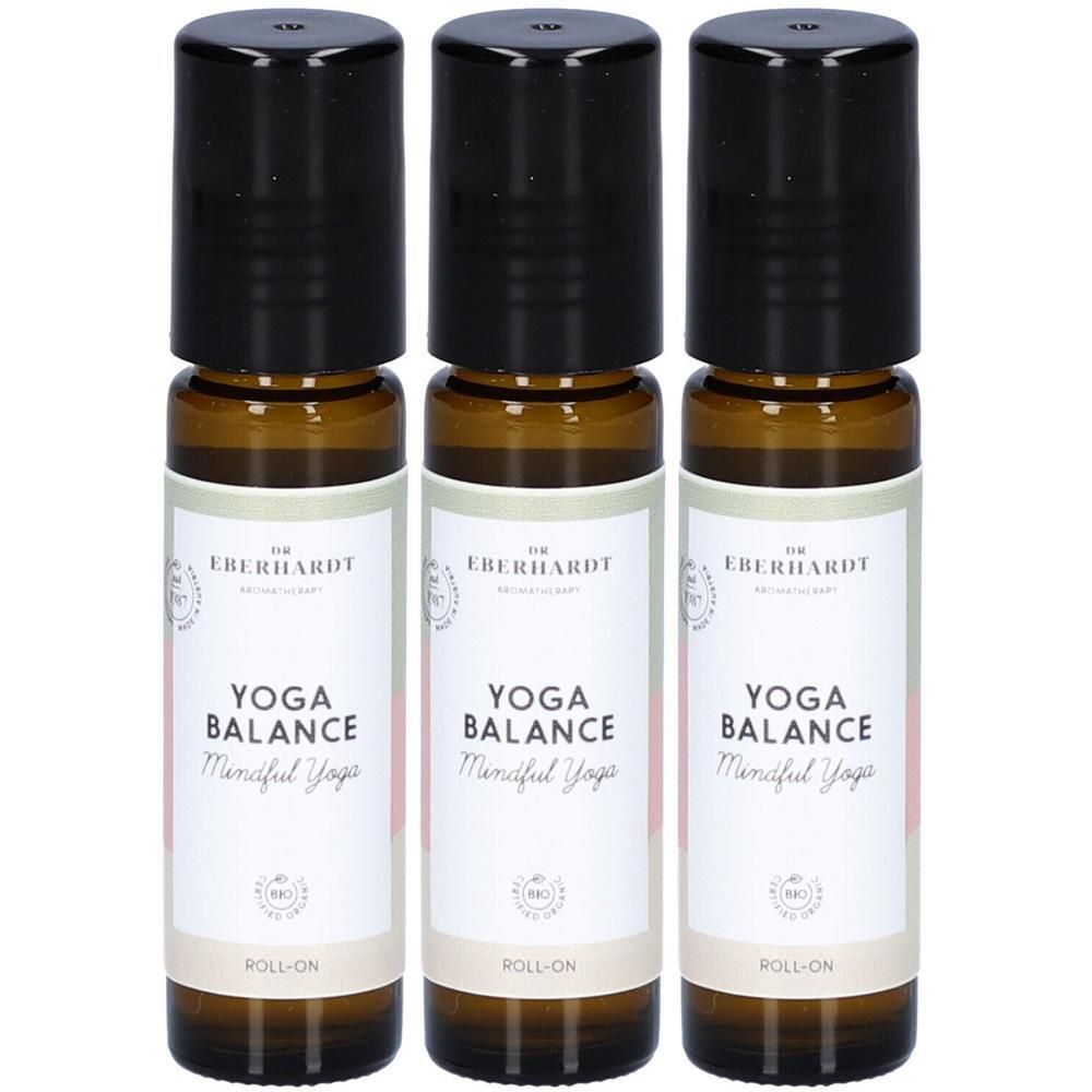 Drei Dr. Eberhardt Yoga Balance Roll-ons mit schwarzen Kappen und Etiketten.