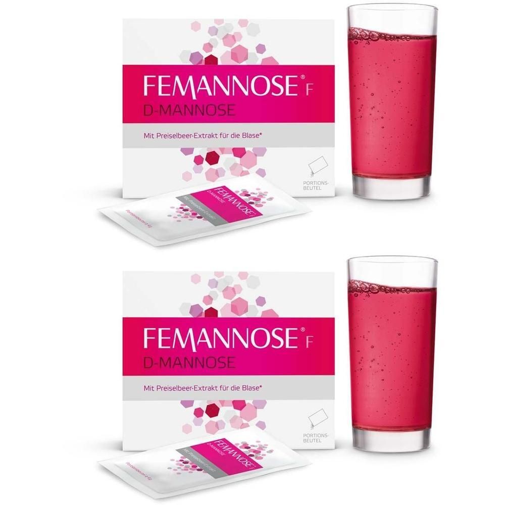 FEMANNOSE F D-Mannose Granulat: Zwei Packungen und zwei Gläser mit rosa Getränk.