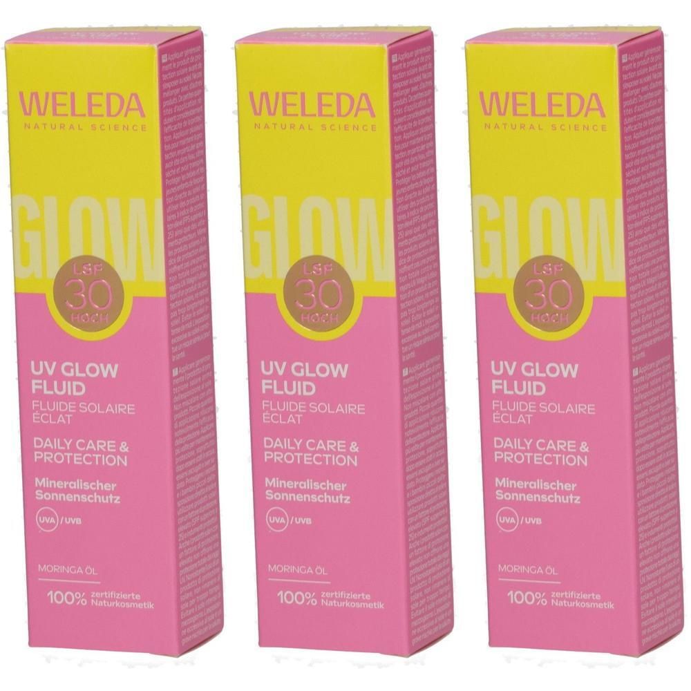 Drei Packungen WELEDA UV GLOW FLUID mit LSF 30. Rosa und gelbe Verpackung mit Produktinformationen.