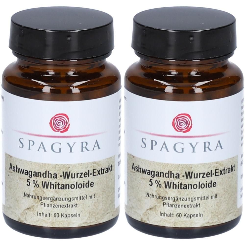 Zwei braune Glasflaschen mit schwarzen Deckeln, gefüllt mit Ashwagandha-Kapseln. Etiketten zeigen 'SPAGYRA' und '5% Withanolide'.