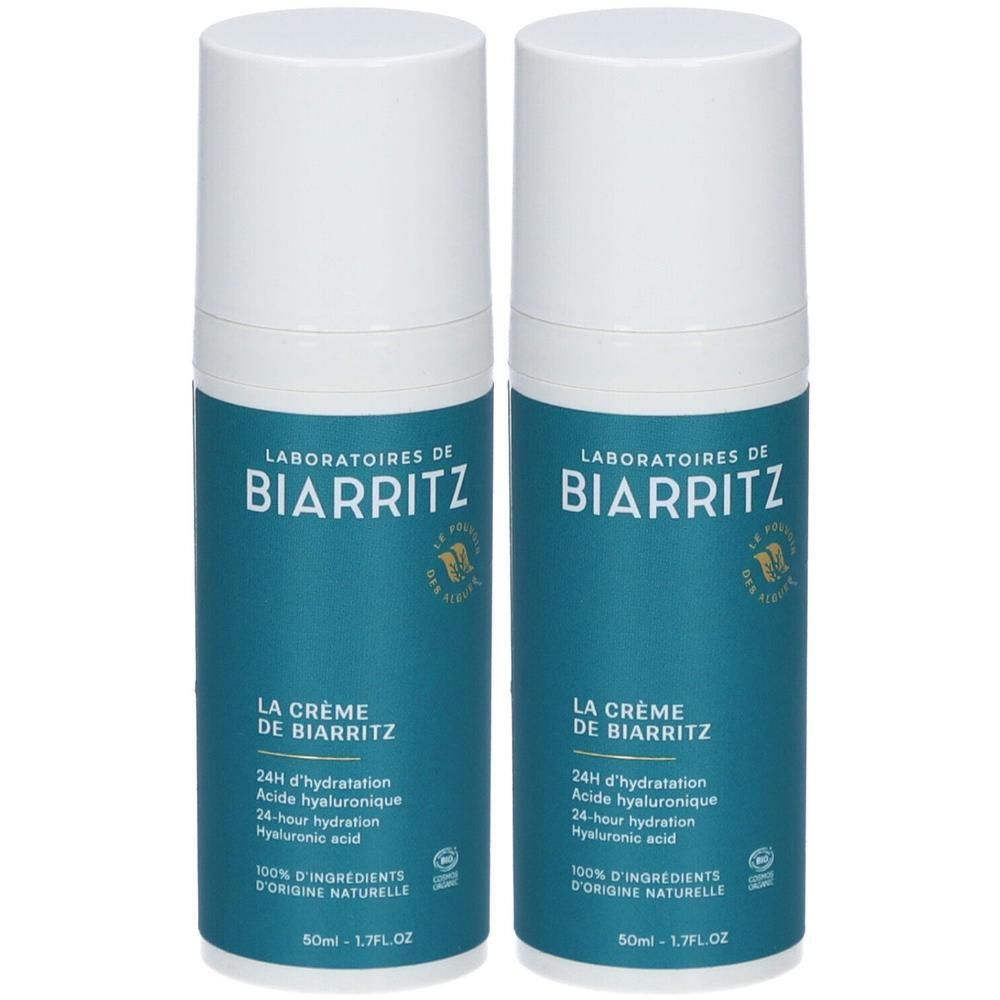 Zwei Flaschen La Crème de Biarritz Gesichtscreme mit Pumpspender. Dunkelblaue Flaschen mit weißem Deckel und Beschriftung.