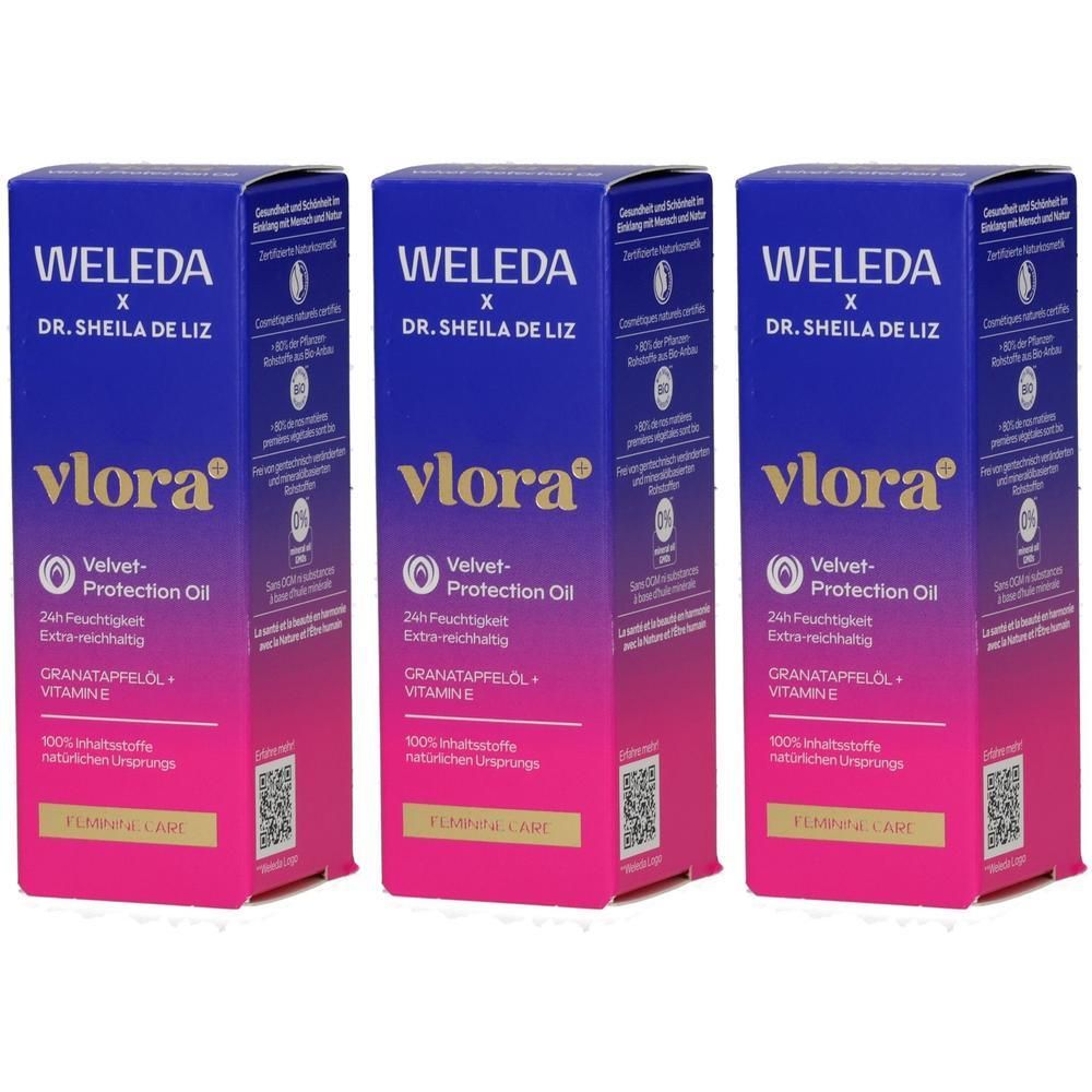 Drei Packungen VLORA Velvet-Protection Oil von WELEDA. Blaue und pinke Verpackung mit goldener Schrift.