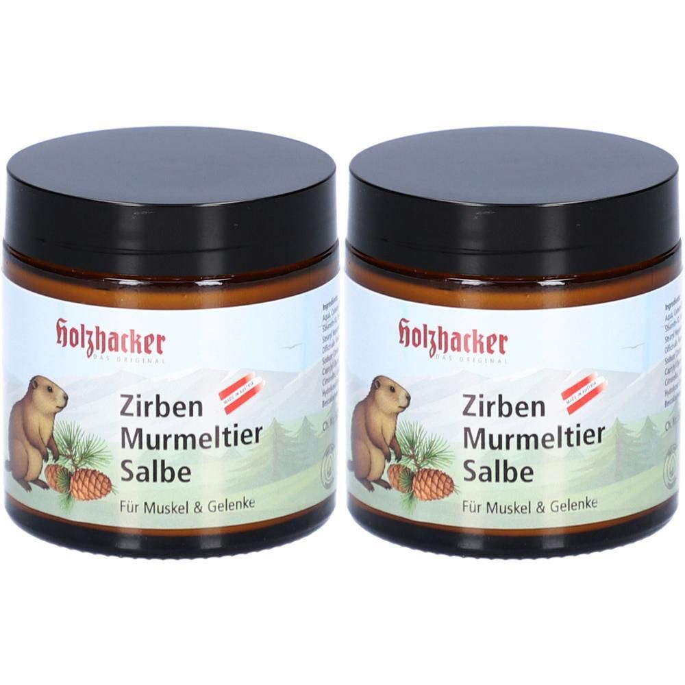Zwei Gläser Holzhacker Zirben Murmeltier Salbe mit schwarzen Deckeln. Etiketten zeigen Murmeltier, Zirbenzapfen und Berge.