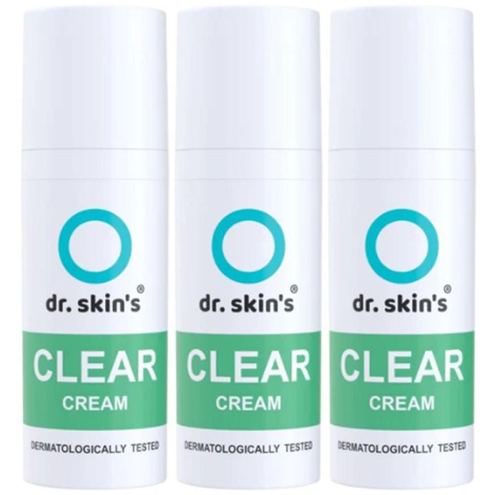Drei weiße Flaschen mit blauem Kreislogo und der Aufschrift 'dr. skin's CLEAR CREAM'. Dermatologisch getestet.
