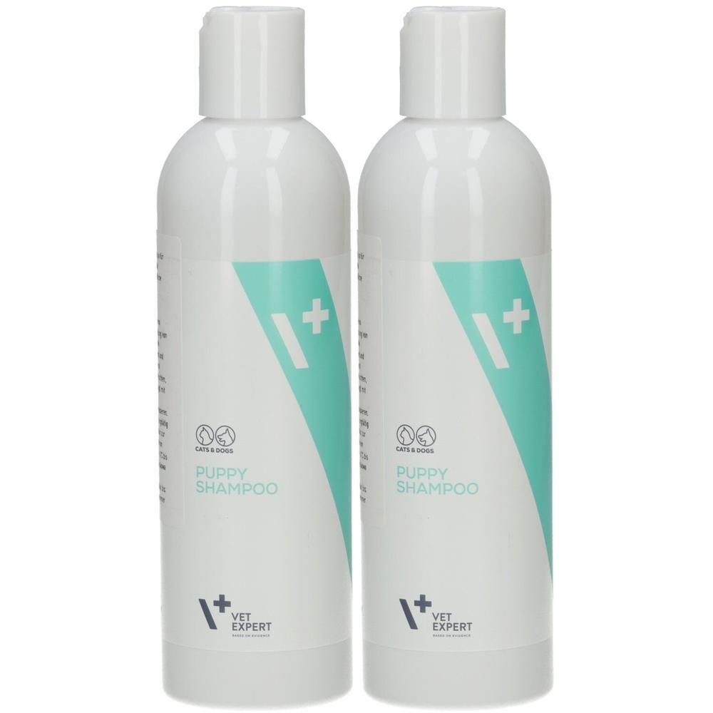 Zwei weiße Flaschen Welpen-Shampoo mit türkisfarbenem Design und Logo.