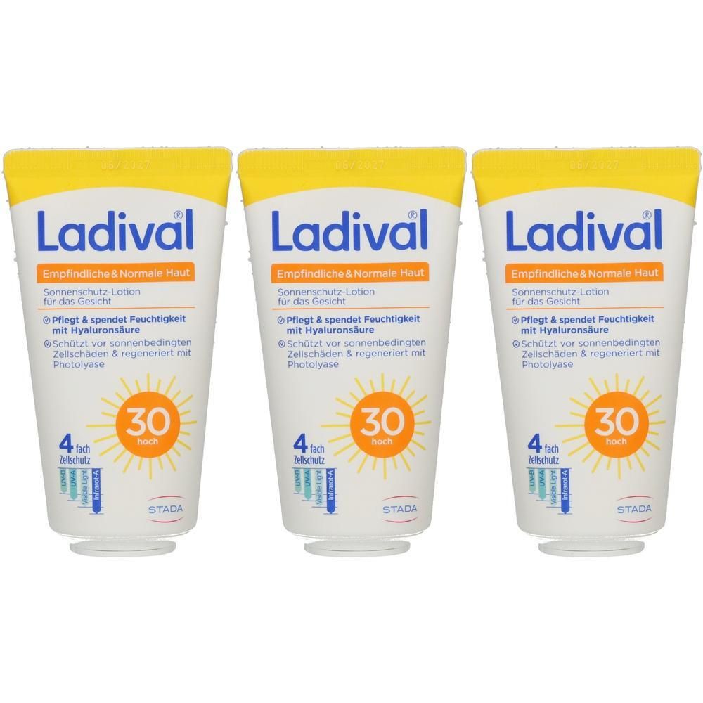 Drei weiße Tuben Sonnenschutz-Lotion Ladiwal mit LSF 30 für das Gesicht. Gelber Deckel, Sonne-Symbol.