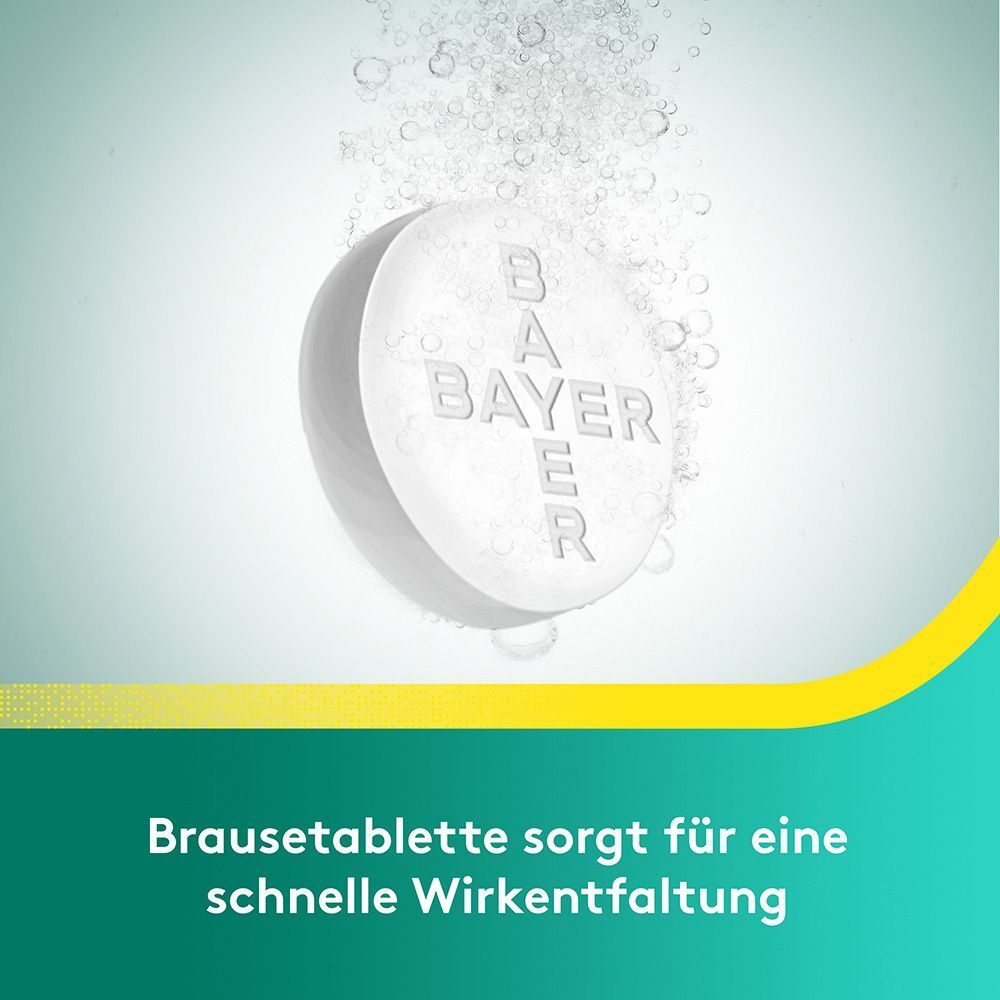 Brausetablette löst sich in Wasser auf, Blasen steigen auf.