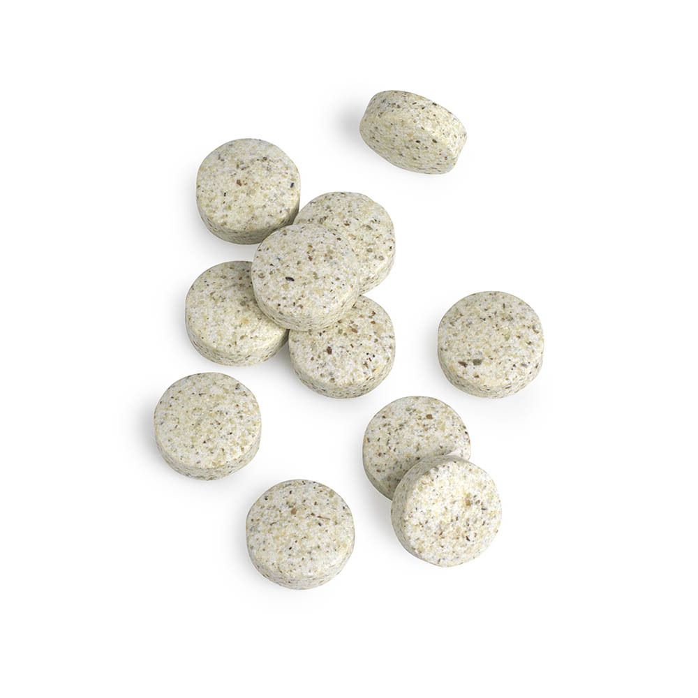 Nahaufnahme von Tabletten. Runde, beige Tabletten mit kleinen Punkten.