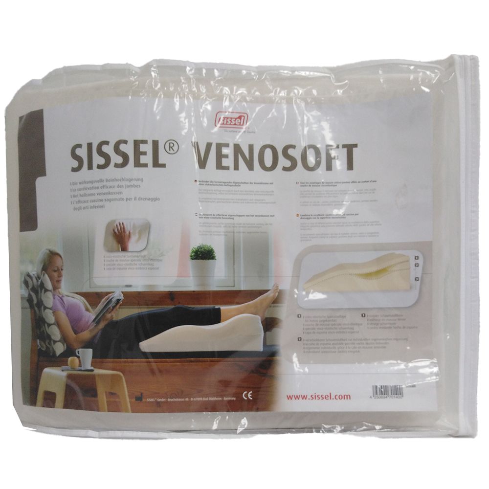 Sissel Venosoft Venenkissen in Verpackung. Weißes Kissen, Frau mit Buch, Produktabbildung.