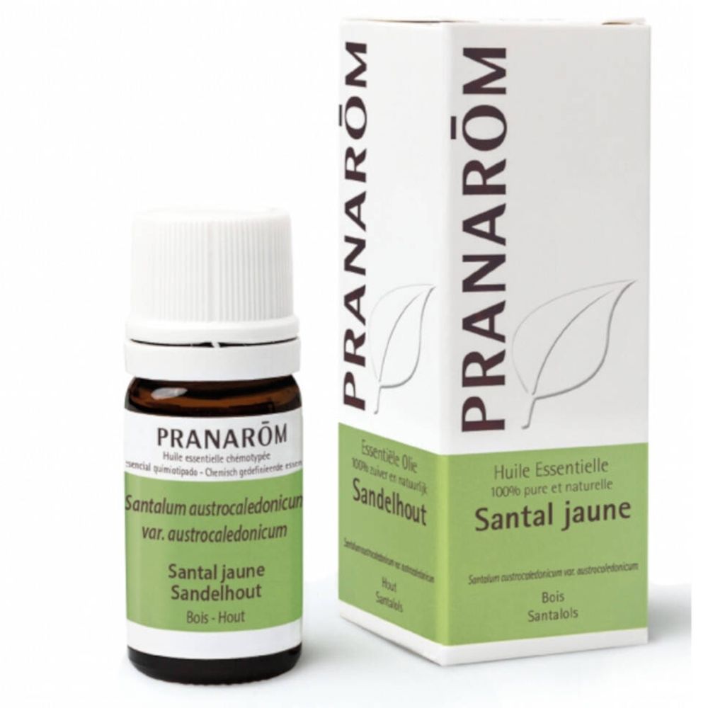 Braune Glasflasche mit weißem Deckel und grüner Etikettierung. Daneben eine weiße Schachtel mit grüner Schrift und Blattmotiv.