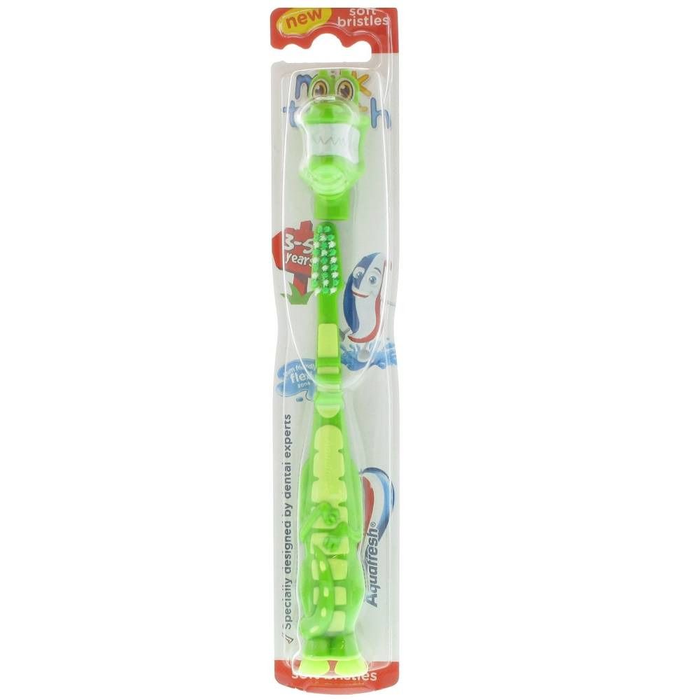 Grüne Kinderzahnbürste mit Krokodil-Design. Weiche Borsten, verpackt. Marke: Aquafresh.