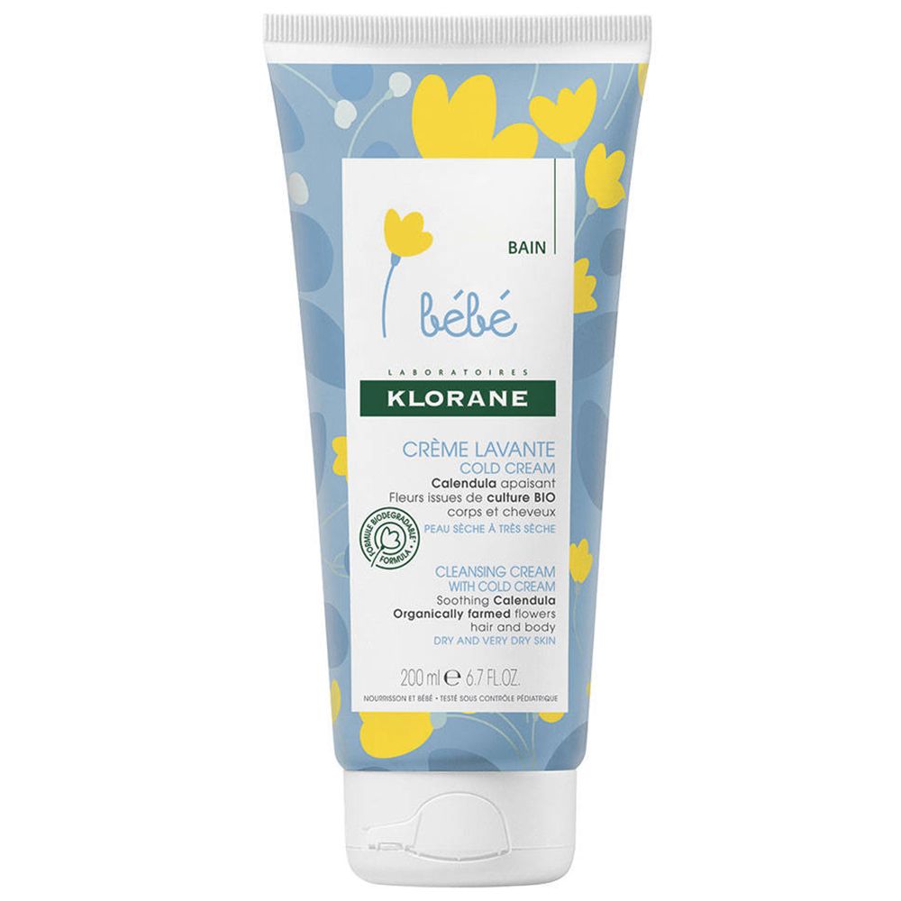 Klorane bébé Waschcreme Cold Cream. Tube mit floralem Muster. Produktbezeichnung und Inhaltsstoffe aufgedruckt.