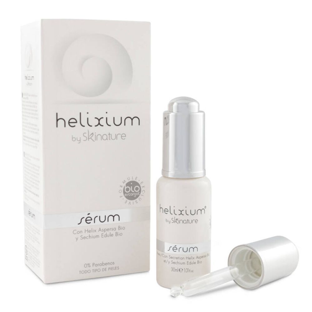 Weißes Serumfläschchen mit Pipette und Verpackung. Aufschrift: helixium by skinature, sérum, BIO-Zertifizierung.